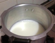 Rice in milk about to boil