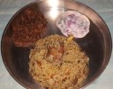Dindukkal thalapakkati briyani served with mutton chukka and raita