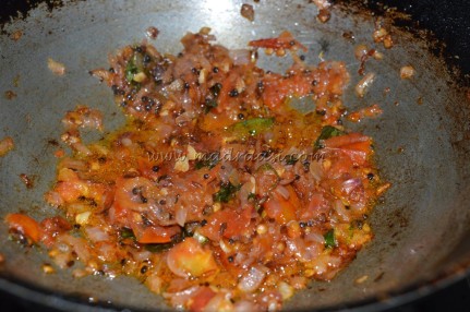 Spices, onion and tomato getting cooked