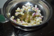 Onions and herbs getting sauted in olive oil